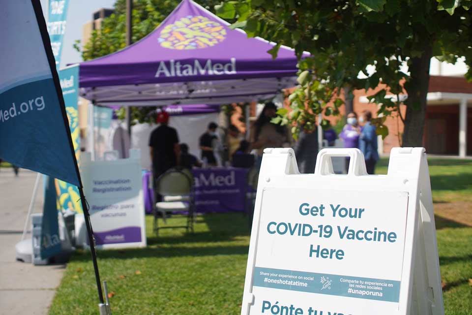 Community members receive their COVID-19 vaccine at the AltaMed COVID-19 Vaccination clinic at Cal State LA.