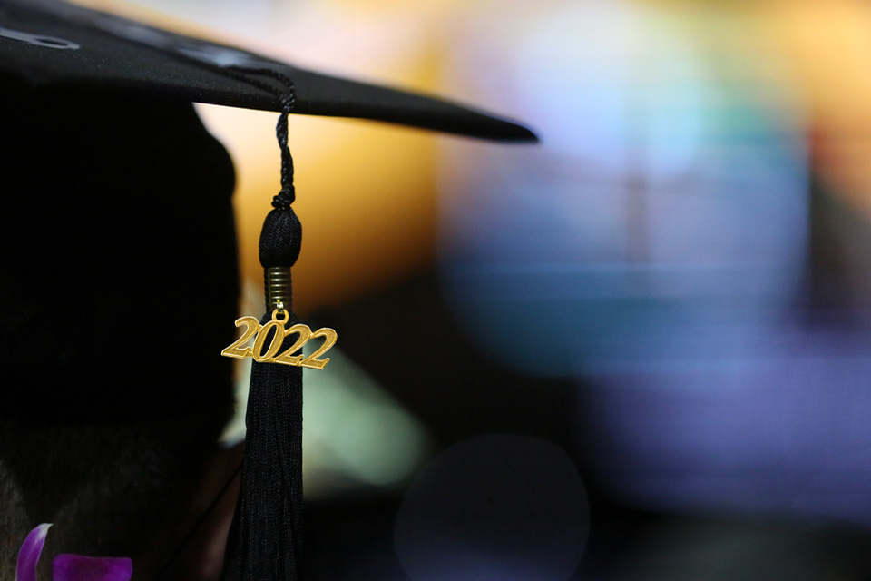 A silhouette of a student's graduation cap with a 2022 tassel hanging down.