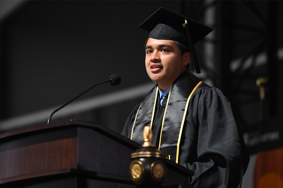Cal State LA Class of 2022 graduate, Erick Rojas-Torres speaking at commencement 2022.