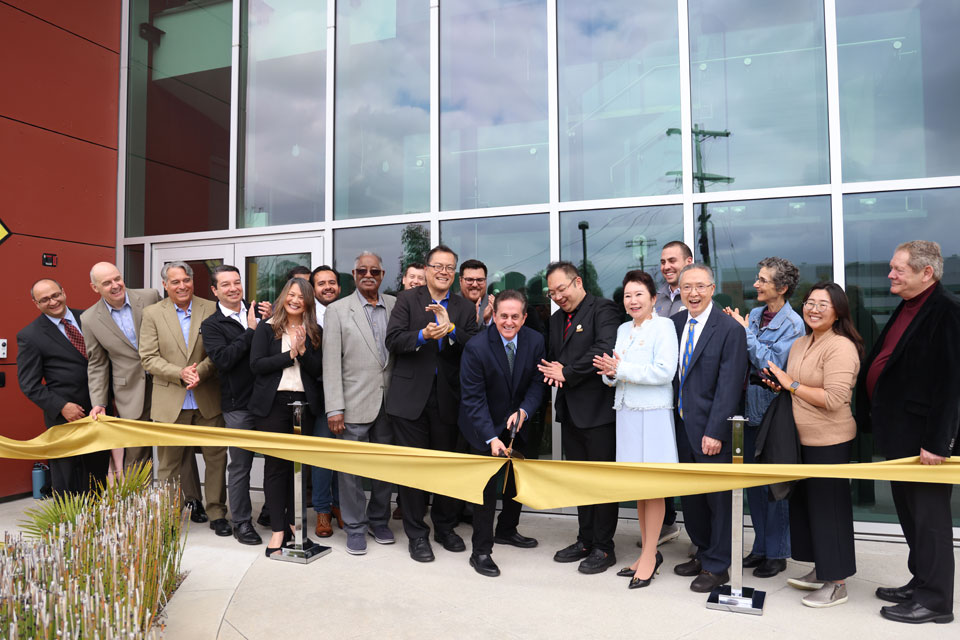Cal State LA Provost and Executive Vice President Jose A. Gomez cuts the ceremonial ribbon at the grand opening of the Rongxiang Xu Bioscience Innovation Center at Cal State LA on April 14, 2023.