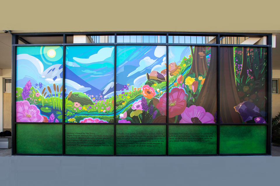 A colorful mural on glass windows.