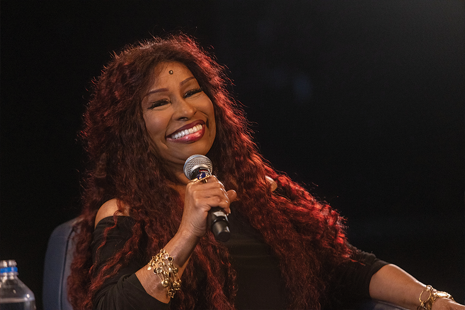 Chaka Khan being interviews and speaking into a microphone.