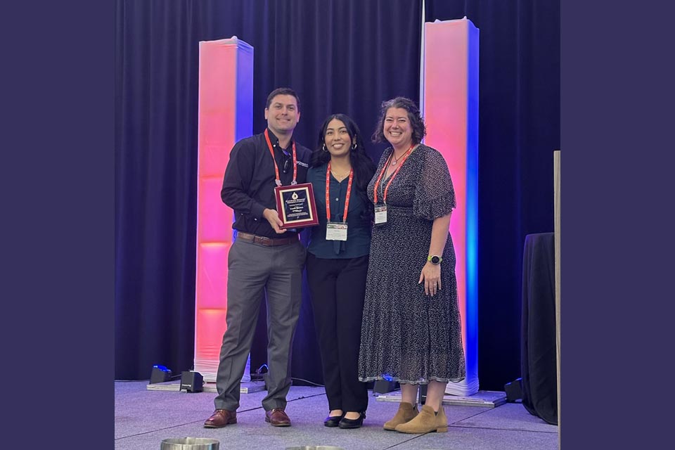 Camila Bautista, center, was honored with the 2025 Outstanding Student Award.