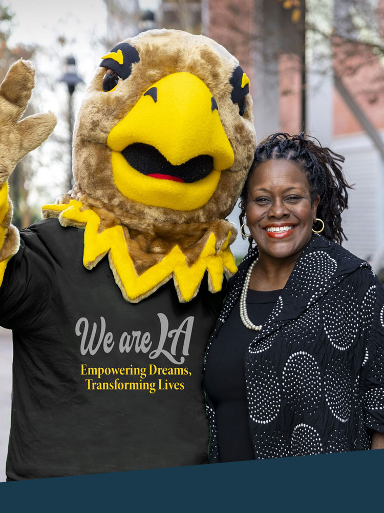 President Eanes and Eddie the Eagle pose for a photo together.