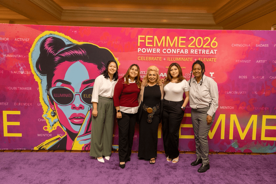 Five participants pose in front of a colorful FEMME 2026 backdrop during the Power Confab Retreat at Cal State LA.