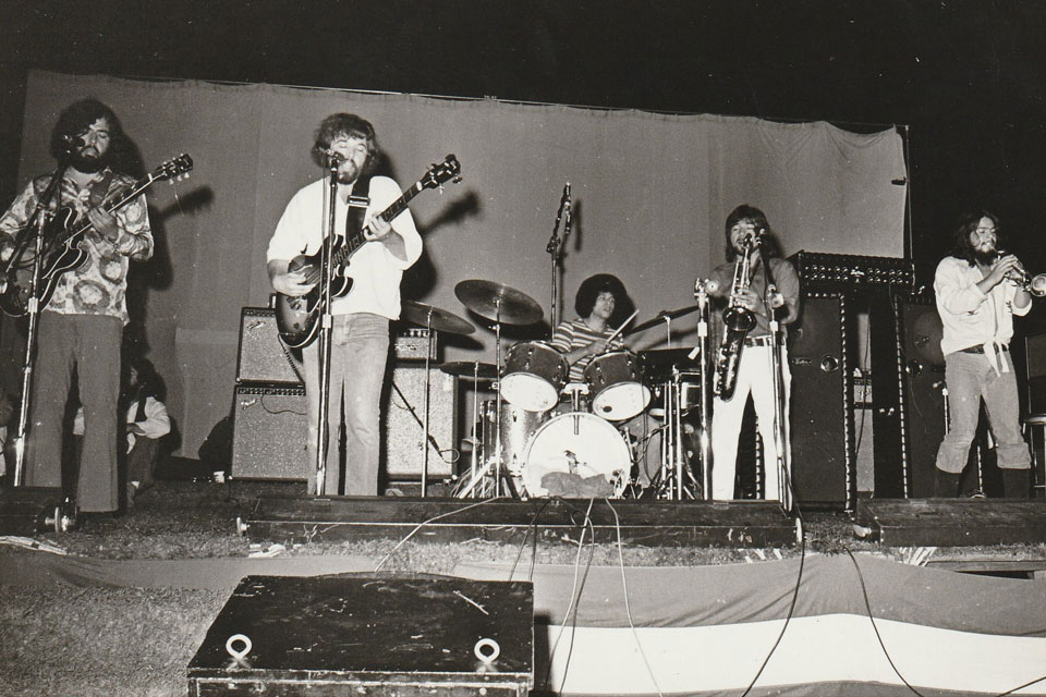 A band performs on stage.