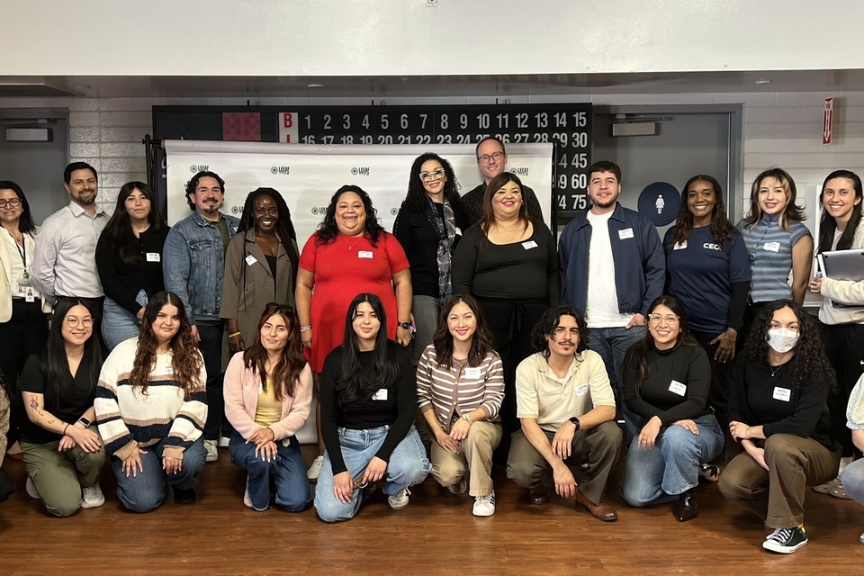 Staff and facilitators pose together for a group photo following a resident meeting.