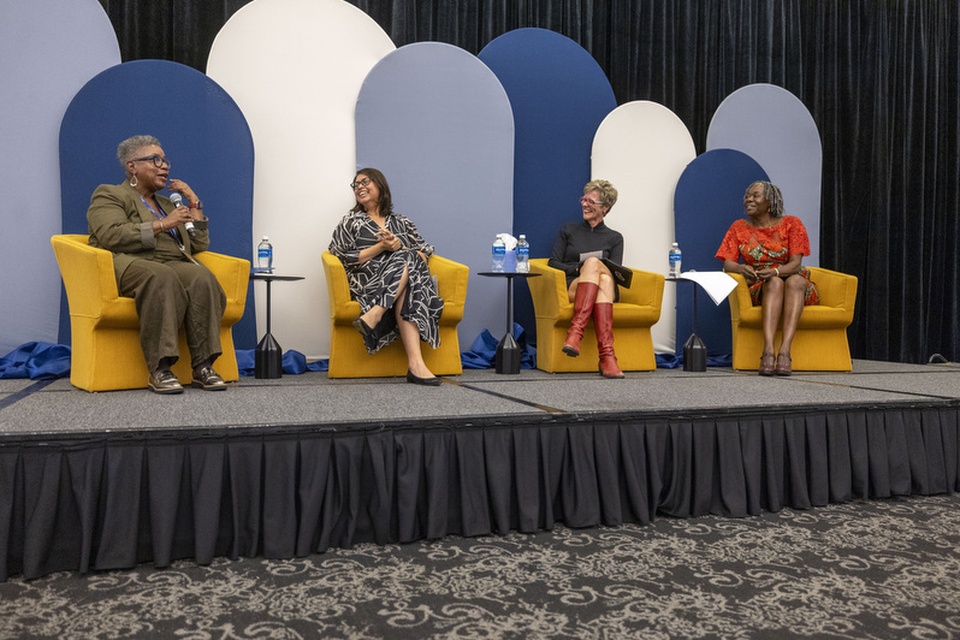 Four panelists participate in a discussion on stage during an ACE event at Cal State LA.