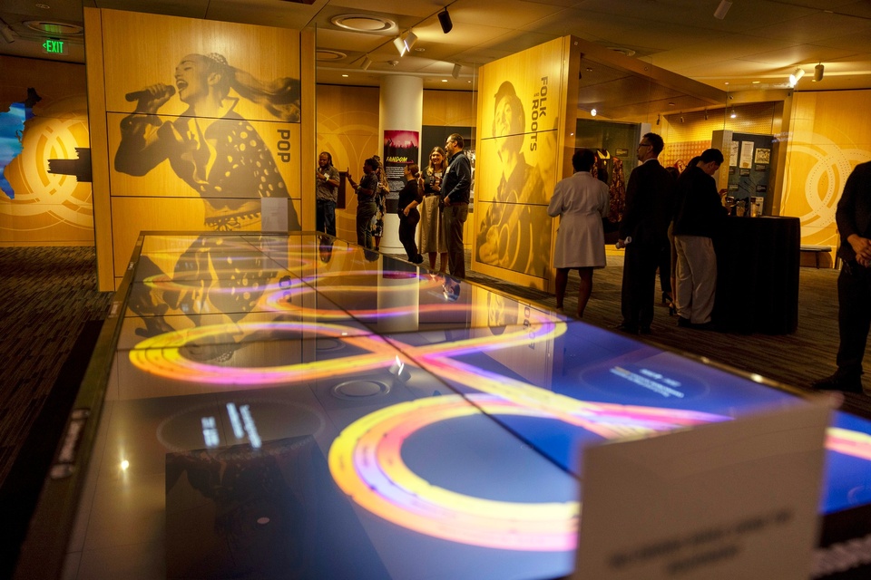 Guests explore music history exhibits at the GRAMMY Museum during a Cal State LA alumni event.