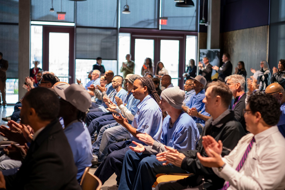 Audience members applaud during a Cal State LA Prison Graduation Initiative event.